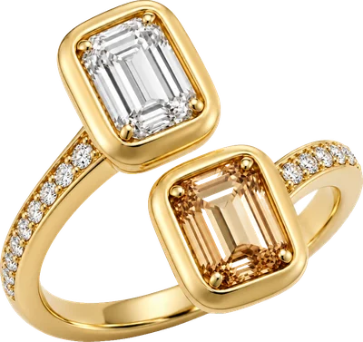 Yellow gold toi et moi ring with emerald cut white and cognac diamonds on a pave band