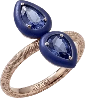 Rose gold ring with two pear cut blue sapphires and blue enamel